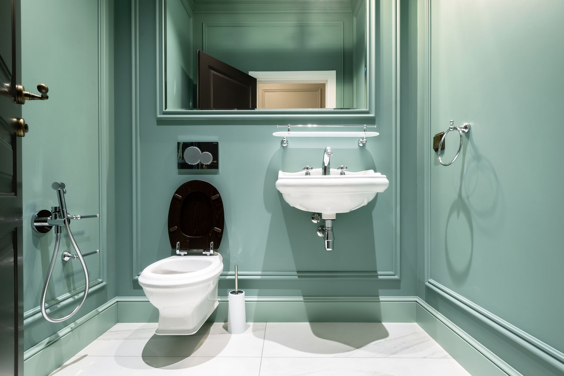 Stylish bathroom design featuring green walls, classic sink, and elegant fixtures in Saint Petersburg.